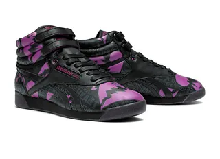 Freestyle Hi - Words and graphics in black and purple adorn this &quot;Broken Heart&quot; wedge sneaker.   (Photo: Reebok)