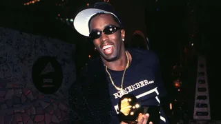 Diddy shows off his first Grammy, which he earned in 1998.