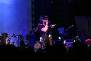 A Thousand Words - Fans capture this intimate moment with Andy Mineo during his headlining set at the May #mmshowcase. (Photo: Anna Webber/Getty Images for BET)