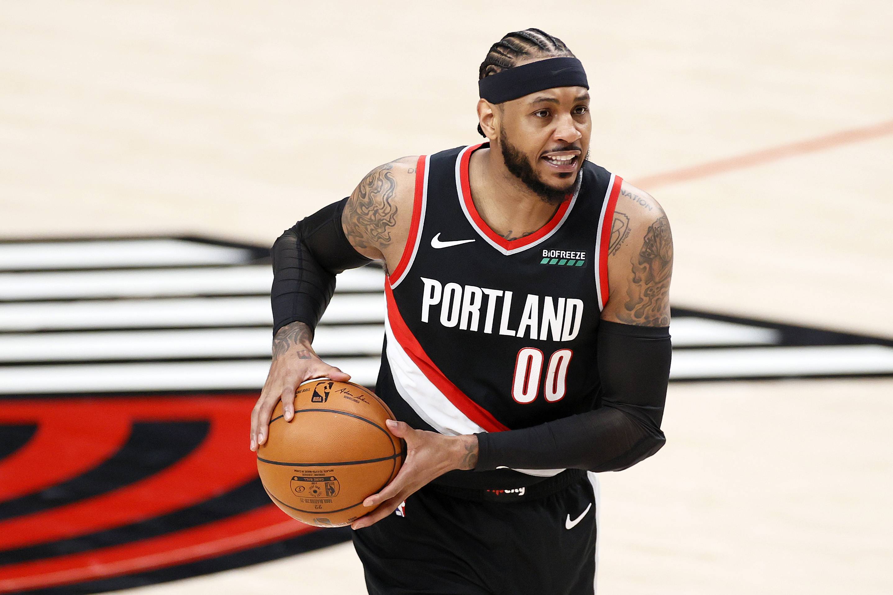 PORTLAND, OREGON - MAY 29: Carmelo Anthony #00 of the Portland Trail Blazers looks to pass in the first quarter against the Denver Nuggets during Round 1, Game 4 of the 2021 NBA Playoffs at Moda Center on May 29, 2021 in Portland, Oregon. NOTE TO USER: User expressly acknowledges and agrees that, by downloading and or using this photograph, User is consenting to the terms and conditions of the Getty Images License Agreement. (Photo by Steph Chambers/Getty Images)