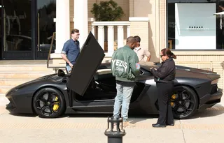 Shopping for Inspiration - Fashion afficionado Kanye West leaves Barney's New York in Beverly Hills wearing his Yeezus Tour flight jacket and driving his Lamborghini Aventador.&nbsp;(Photo: revolutionpix/WENN.com)