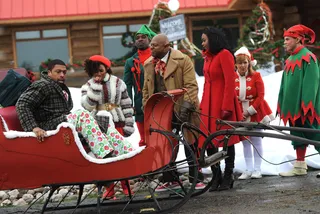 What'd You Do? - Larry lands pretty safely to help give away presents.   (Photo: BET)