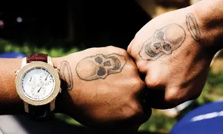 Skulls - Twin skulls with halos adorn his hands.   (Photo: Chris Brown via Twitter)