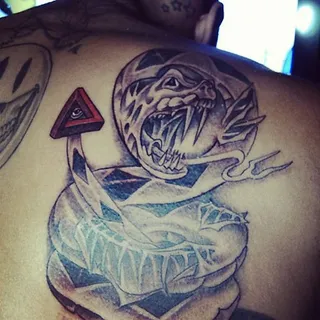 Rattlesnake - A fierce rattlesnake makes its mark on one shoulder blade. (Photo: Chris Brown via Instagram)