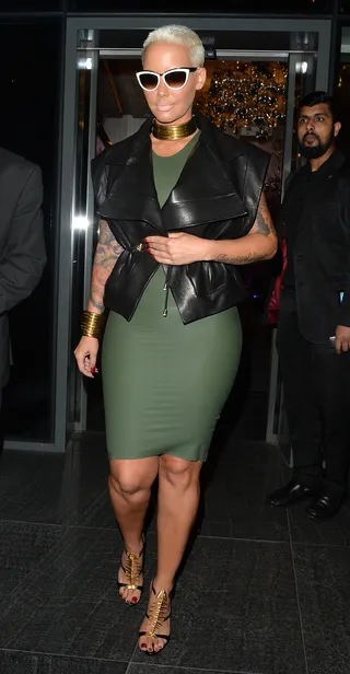 The Fierceness - Amber Rose&nbsp;shows her curves in an olive bodycon dress while leaving her London hotel.&nbsp;(Photo: Palace Lee, PacificCoastNews)