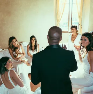 The Kardashian-Jenner Ladies - We all remember this pic that circulated the Internet of Kanye West having a moment with the Kardashian-Jenner ladies minutes before his and Kim's grand Italian wedding. It was another all-white affair with dress styles that reflected their individual tastes.  (Photo: Khloe Kardashian via Instagram)