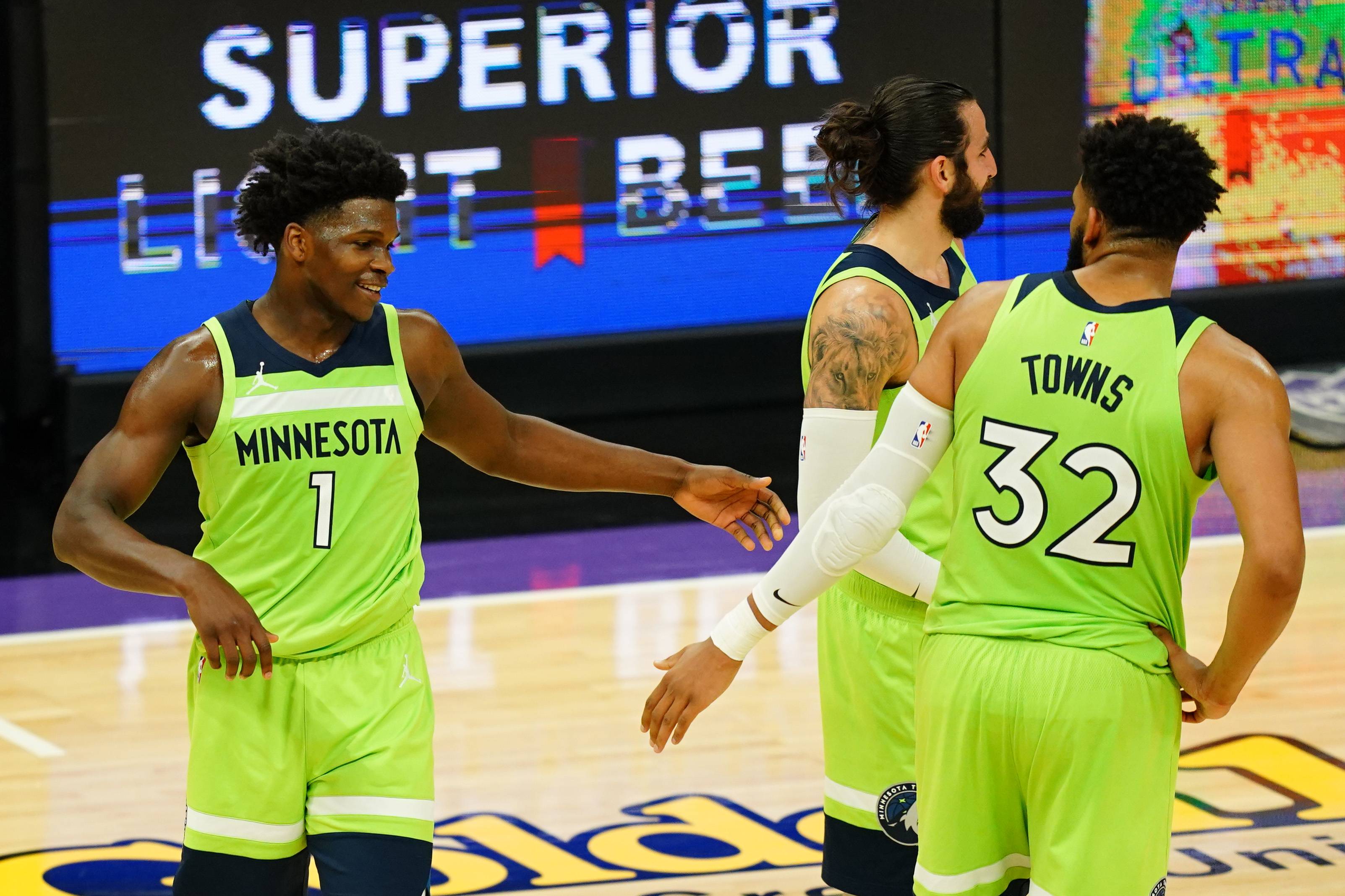 SACRAMENTO, CALIFORNIA - APRIL 20: Anthony Edwards #1 and Karl-Anthony Towns #32 of the Minnesota Timberwolves celebrate a win over the Sacramento Kings at Golden 1 Center on April 20, 2021 in Sacramento, California. NOTE TO USER: User expressly acknowledges and agrees that, by downloading and or using this photograph, User is consenting to the terms and conditions of the Getty Images License Agreement. (Photo by Daniel Shirey/Getty Images)