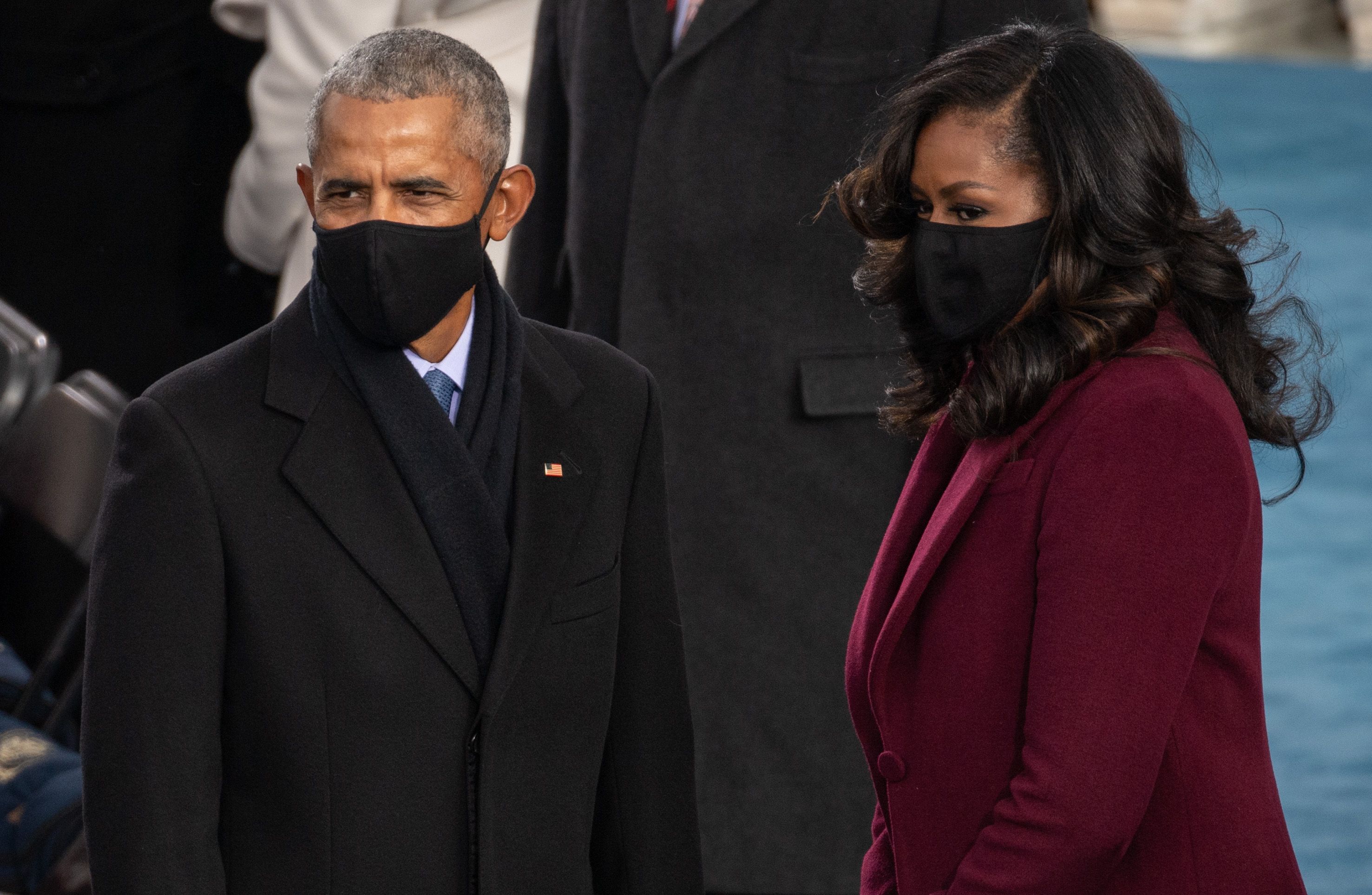 WASHINGTON, DC - JANUARY 20: (L-R)  Former US President Barack Obama and Former US First Lady Michelle Obama arrive to the 59th Presidential Inauguration at the U.S. Capitol on January 20, 2021 in Washington, DC. During today's inauguration ceremony Joe Biden becomes the 46th president of the United States. (Photo by Saul Loeb - Pool/Getty Images)