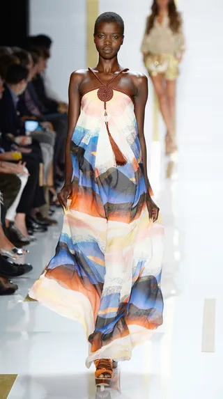 Diane Von Furstenberg Spring 2014 - A gorgeous braided neckline highlights the soothing blues and copper hues of this breezy maxi dress.  (Photo: Frazer Harrison/Getty Images for Mercedes-Benz)