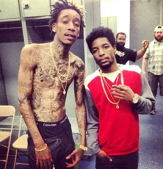 Wiz Khalifa @mistercap - New dad Wiz Khalifa stops for a quick snapshot backstage with MMG rapper Rockie Fresh. #TaylorGangxMMG (Photo: Instagram via Wiz Khalifa)