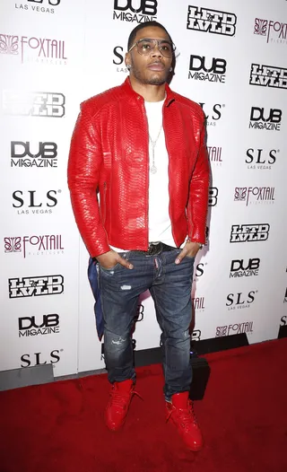 Flamed Up - Nelly arrives at the DUB Magazine SEMA Party in a bright red jacket and sneakers at Foxtail Nightclub inside SLS Las Vegas.(Photo: Judy Eddy/WENN.com)