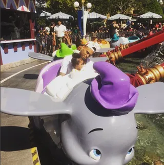 I Believe I Can Fly - CB takes Royalty to Disneyland and they prepare to take flight on Dumbo.(Photo: Chris Brown via Instagram)