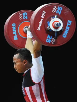 Triyatno Triyatno Comes in Second - Indonesian weightlifter Triyatno Triyatno won the silver medal during the Men's 69kg Weightlifting Final. (Photo: Laurence Griffiths/Getty Images)