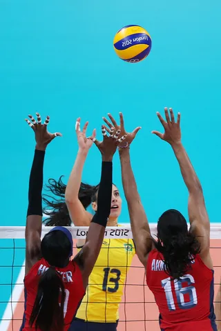 All Hands on Deck - Brazil's Sheilla Castro spikes the ball in the women's volleyball preliminary match against the U.S. (Photo: Elsa/Getty Images)