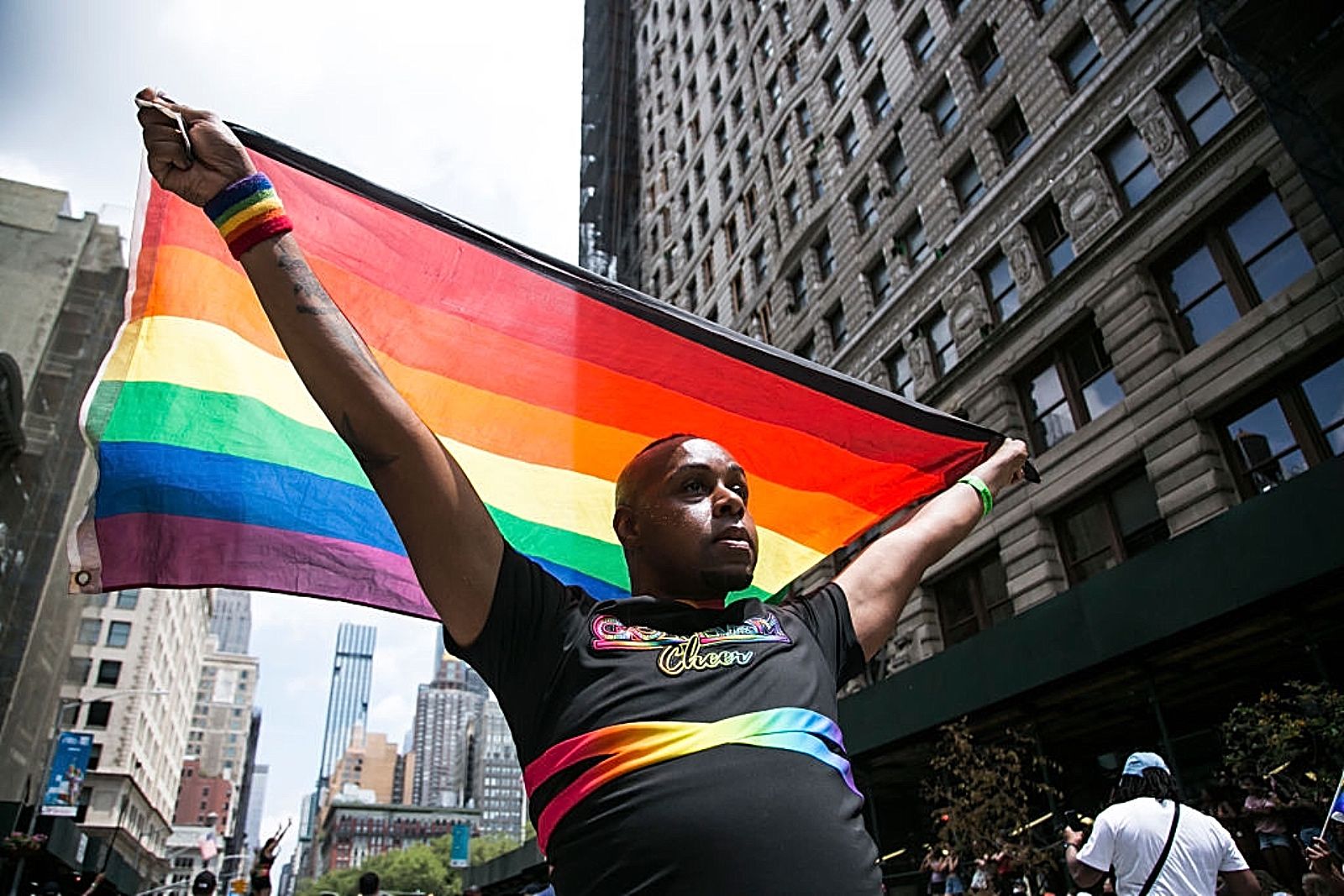 NEW YORK, NEW YORK - JUNE 27: A man with a flag walks during the Queer Liberation March parade on June 27, 2021 in New York City. Many participants walk around town to celebrate New York City Pride. The Queer Liberation March is an alternative Pride celebration free of police officers and major corporate sponsors. (Photo by Pablo Monsalve / VIEWpress via Getty Images)