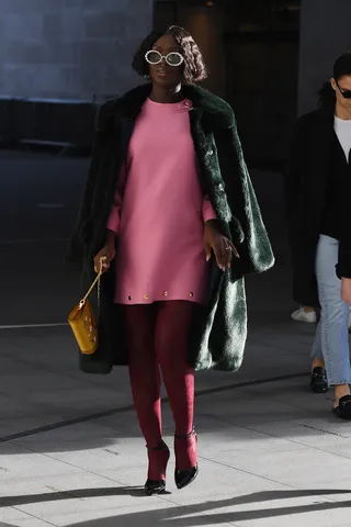 Pink Lady&nbsp; - Jodie Turner-Smith wore a pink midi-dress while out-and-about in London. Jodie's maternity is #goals.&nbsp;(Photo: Neil Mockford/GC Images) (Photo: Neil Mockford/GC Images)