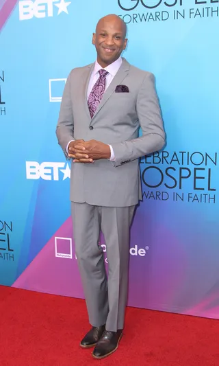 Ready to Go - Legendary vocalist Donnie McCLurkin took the red carpet by storm in his light grey suit complete with purple pocket square and tie.(Photo: Maury Phillips/BET/Getty Images for BET)