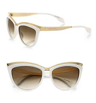 Alexander McQueen Two-Tone Cat-Eye Sunglasses  - The sleek cat-eye shape of McQueen’s two-tone frames make them a versatile option that you can dress up or down. Wear them with a flowy maxi or boy shorts and a tee.  (Photo: Alexander McQeen)