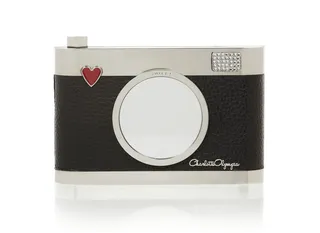 Flashback Brass and Textured-Leather Clutch - Calling all Instagram stars! This clutch will have you on every fashionista’s newsfeed. Details like the Swaroski crystal 'flash' and mirrored lens make it chic and functional.  (Photo: Net A Porter)&nbsp;