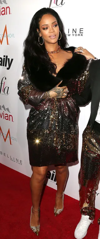 Rihanna - Rih works a sequin Moschino Pre-Fall 2015 frock and Louboutin pumps at the Daily Front Row’s&nbsp;Fashion Los Angeles Awards in West Hollywood. She strikes gold with this look! By Jazmine A. Ortiz(Photo: Frederick M. Brown/Getty Images)