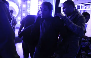 Ready to rock. - Lloyd is putting on his blazer and getting ready to hit the A Very BET Christmas set. (Photo: John Ricard / BET)