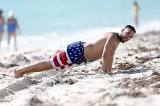 French Going Hard - French Montana is seen on the beach with his friends in Miami after a long night of partying at the Revolt Music Conference. Looks like he is trying to get those pecs up!(Photo: Thibault Monnier/LCD, PacificCoastNews)