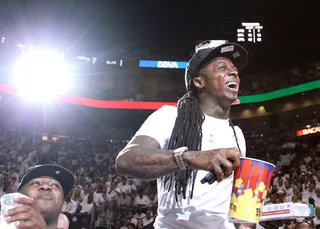 Low Heat - Rapper lil Wayne watches as the Dallas Mavericks beat the Miami Heat to win the 2011 NBA Finals. (Photo by Mike Ehrmann/Getty Images)