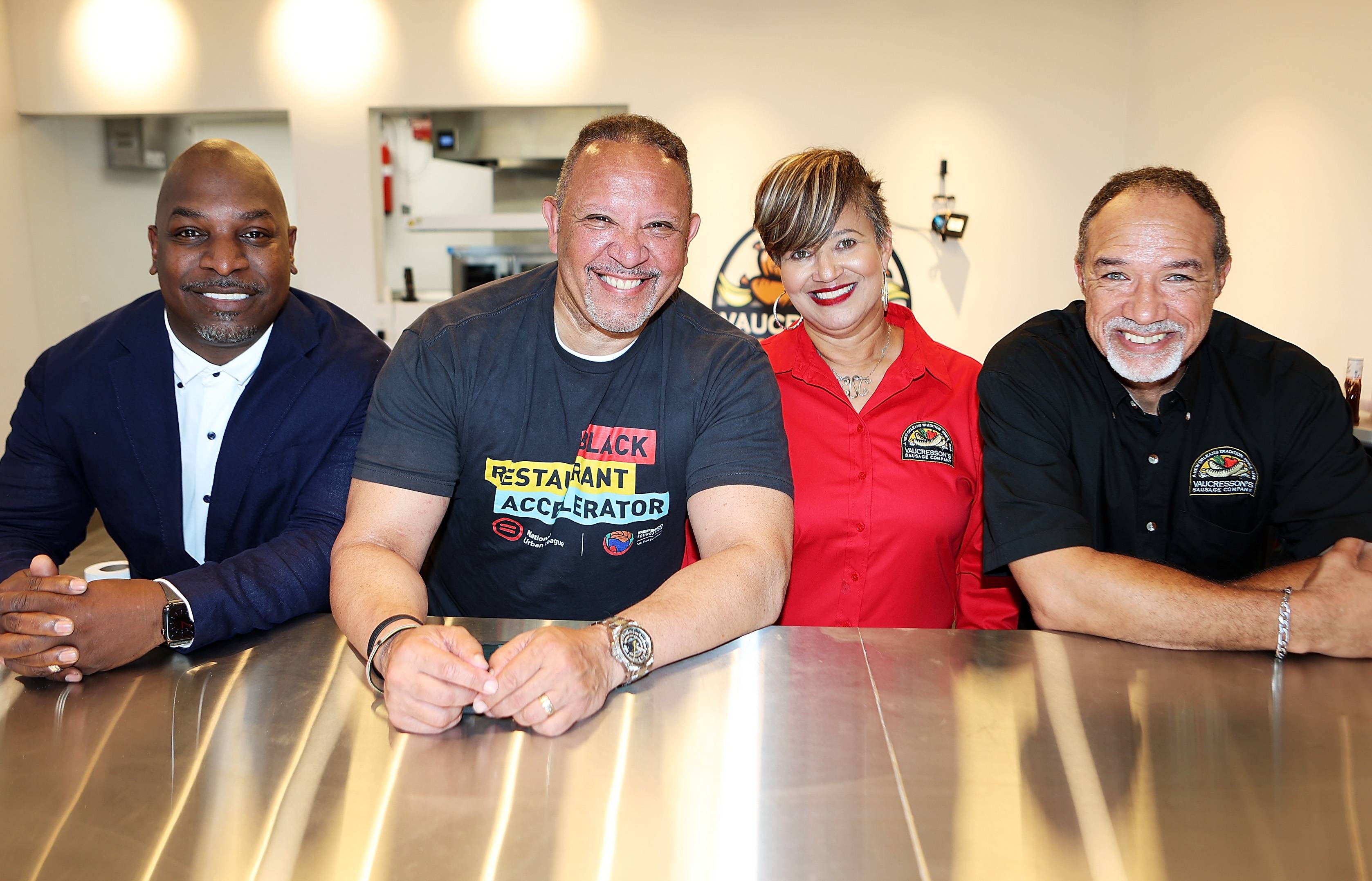 The Vaucresson family, of the Vaucressons Sausage Company, posing for a picture at the Black Restaurant Accelerator Program in New Orleans. 