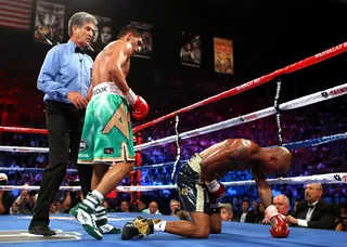 Khan-Judah\r&nbsp; - Amir Khan knocks out Zab Judah in the fifth round following a punch that appeared to be a low blow at first glance.\r&nbsp;\r(Photo: Scott Heavey/Getty Images)