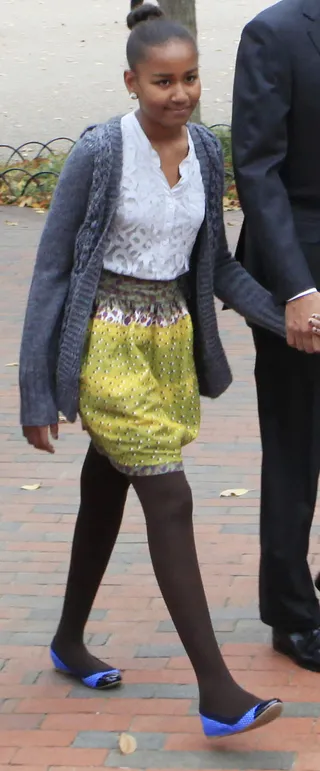 Girl on the Town - We love how she adds a dash of the unexpected by teaming her fun and youthful look with a bold pair of royal blue flats. And her signature high bun perfectly complements this trendy-meets-sophisticated look. (Photo: Dennis Brack-Pool/Getty Images)