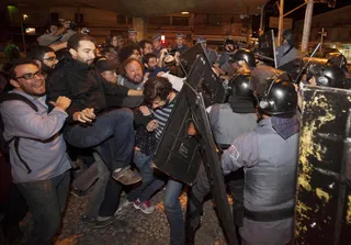 Police Launch Tear Gas at Brazilian Protesters - Protesters contributing to a subway strike in Brazil were sprayed with tear gas by police on Monday — just three days before the World Cup. The protesters are angered by the $11 billion World Cup budget in the midst of a sagging economy and high inflation.&nbsp;(Photo: AP Photo/Mario Angelo)