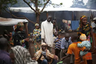 The Gates' Guards - The compound’s gates are guarded by armed Cameroonian peacekeepers who have managed to keep the Christian militia fighters at bay.(Photo: AP Photo/Jerome Delay)