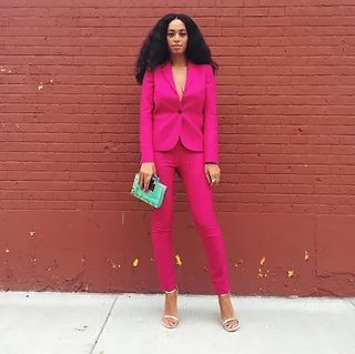 Solange @saintrecords - Pretty in pink took on a new meaning when Solange slayed in this fuchsia pantsuit with a mint green clutch and gold heels to match!   (Photo: Solange Knowles via Instagram)