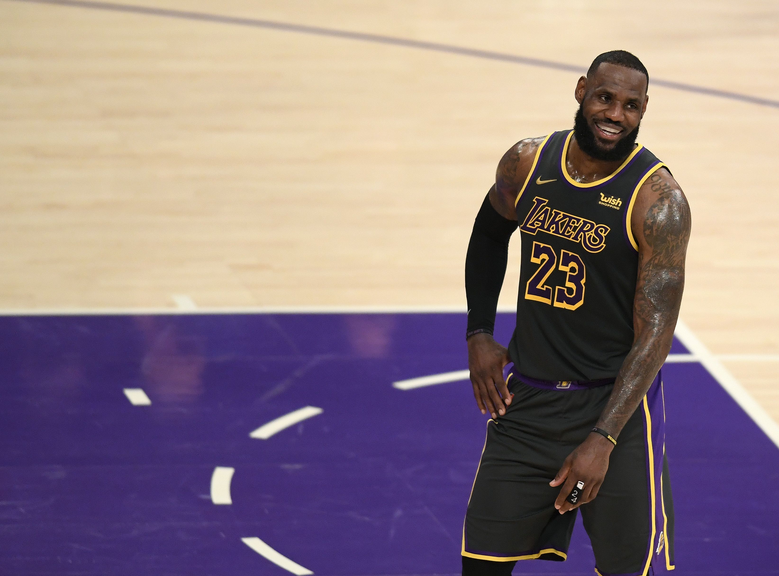 LOS ANGELES, CALIFORNIA - MARCH 12: LeBron James #23 of the Los Angeles Lakers smiles during a 105-100 Lakers win over the Indiana Pacers at Staples Center on March 12, 2021 in Los Angeles, California. (Photo by Harry How/Getty Images)  NOTE TO USER: User expressly acknowledges and agrees that, by downloading and/or using this Photograph, user is consenting to the terms and conditions of the Getty Images License Agreement. Mandatory Copyright Notice: Copyright 2021 NBAE.
