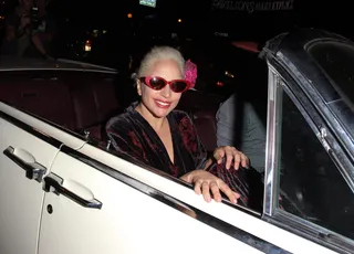 Go, Gaga, Go - Lady Gaga gives a '50s vibe as she leaves Pump Lounge in West Hollywood riding in a classic car and wearing cat-eye sunglasses.(Photo: FJRNEWZ / Splash News)
