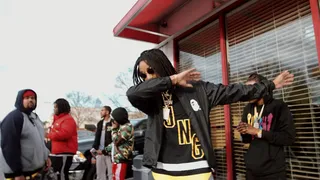 Dab on the Hometown - Outside of the barbershop Quavo flexes for the camera.(Photo:&nbsp;BET for #BLX)