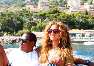 Feeling the Love - Beyoncé grins as she and Jay enjoy some chill time on the waterfront. Her smile says it all.(Photo: Courtesy of IamBeyonce)