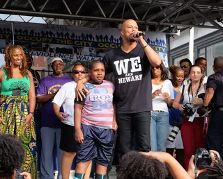 Fist Up - Rapper-actor Common speaks to the crowd of Newark residents at the "Occupy the City" Anti-Violence Rally in New Jersey.(Photo: Dave Kotinsky/Getty Images)