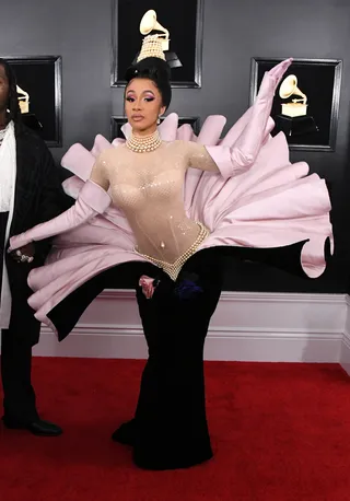 Cardi B - Cardi is stunning in a velvet black and pink gown. (Photo: Jon Kopaloff/Getty Images)