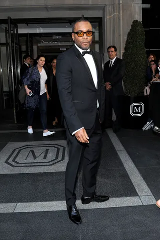 Lee Daniels - The director makes his classic tux pop with the addition of translucent orange frames.  (Photo: Andrew Toth/Getty Images for The Mark Hotel)