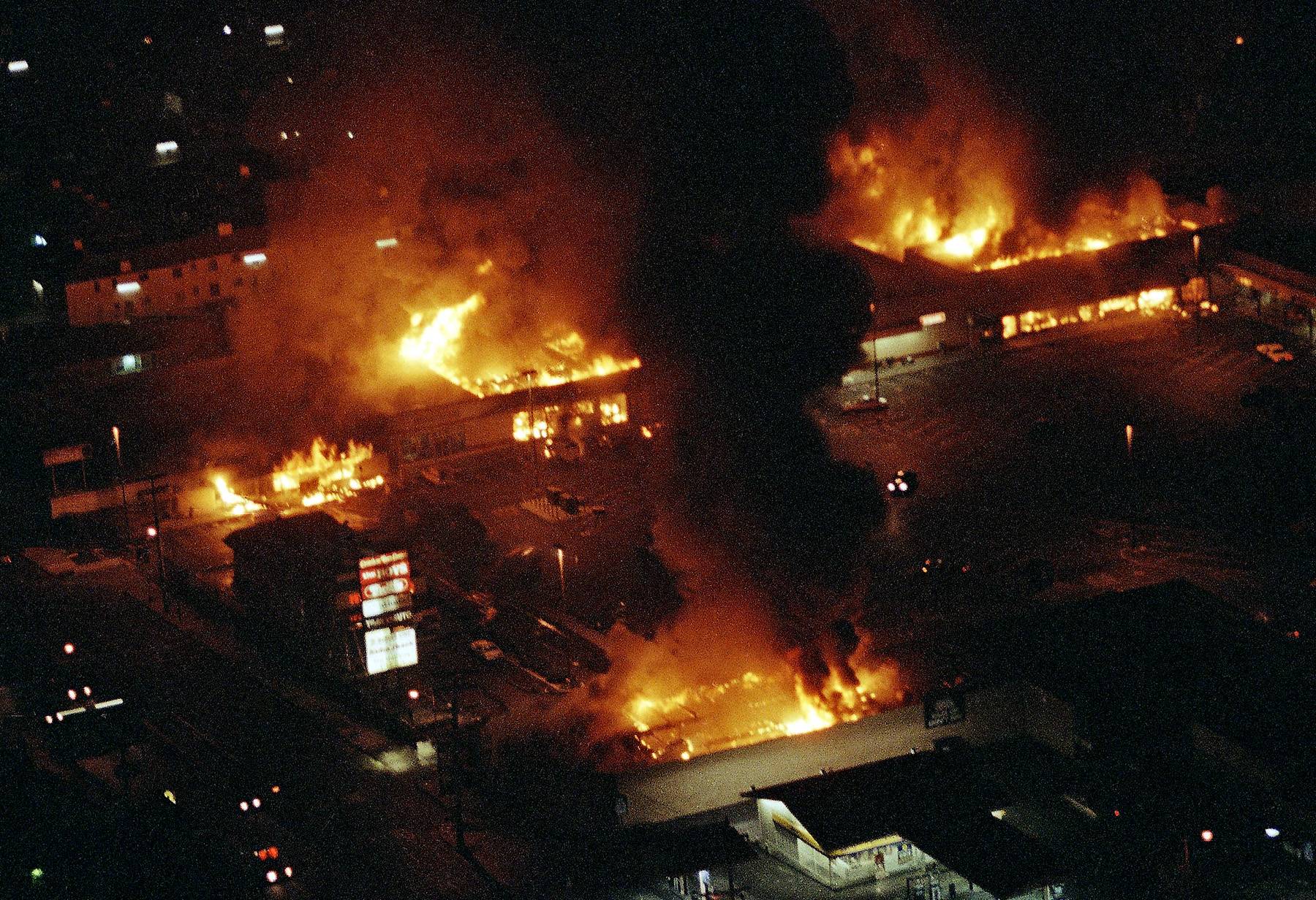 Burning and Looting - Following the acquittal of the officers, rioters began looting and setting fire to businesses and buildings around the city.&nbsp;  (Photo: AP Photo/Reed Saxon, File)