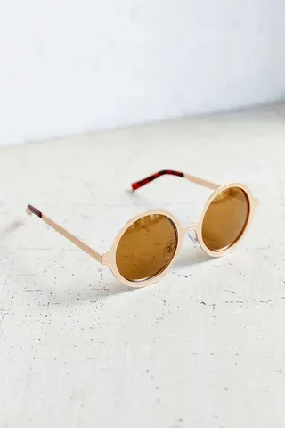 Round Sunnies - Channel an early '90s Lisa Bonet in these circle shades. Cop these at Urban Outfitters&nbsp;($18).  (Photo: Urban Outfitters)