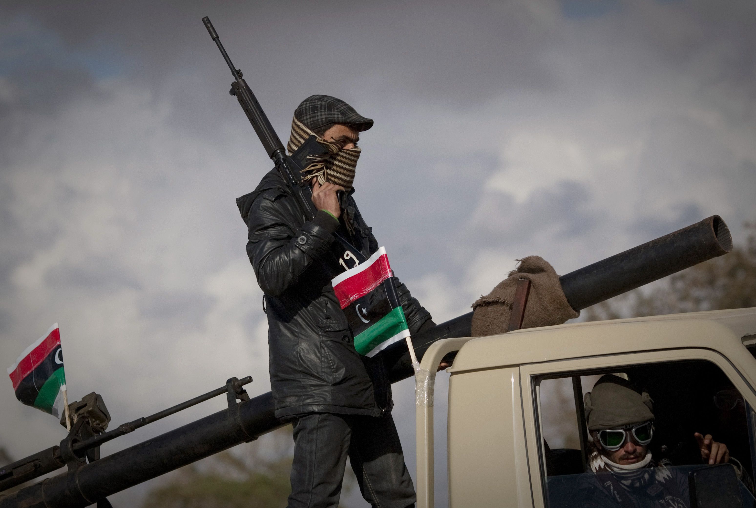 Violence Continues - Rebels claimed control of the city of Misratah on February 24. Government forces bombed a mosque taken over by protesters in the city of Zawiyah, which is only 30 miles away from the capital, Tripoli. In this photo, Libyan rebels patrol the center of Benghazi on March 20.  (Photo: AP Photo/Anja Niedringhaus)