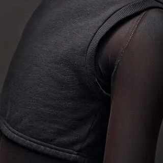 Details - An early IG post of one of the garments that showed on the runway today. We’re digging the cropped sweatshirt layered over a sheer long-sleeved top.&nbsp;(Photo: yeezyseason2 via Instagram)