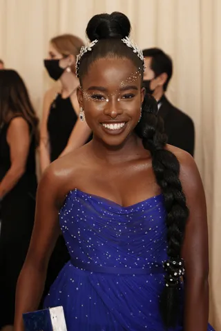 Amanda Gorman - Amanda Gorman was inspired by the iconic Statue of Liberty wearing a top knot bun with a floor-sweeping braid.&nbsp; (Photo by Arturo Holmes/MG21/Getty Images)