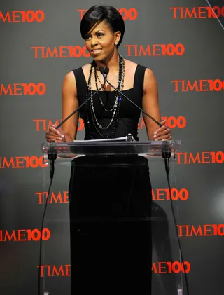 Sleek Sophistication  - The First Lady was prim and polished — and showing off her guns! — in this Michael Kors cocktail dress at the Time Gala in May 2009.  (Photo: Kevin Mazur/WireImage for Time Inc.)