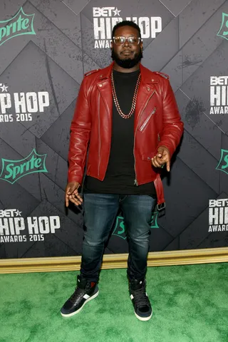 Lethal Leather  - T-Pain blesses the carpet in a burgundy leather jacket and long black tee. The outfit is an edgy and cool look for the carpet. (Photo: Bennett Raglin/BET/Getty Images for BET Networks)