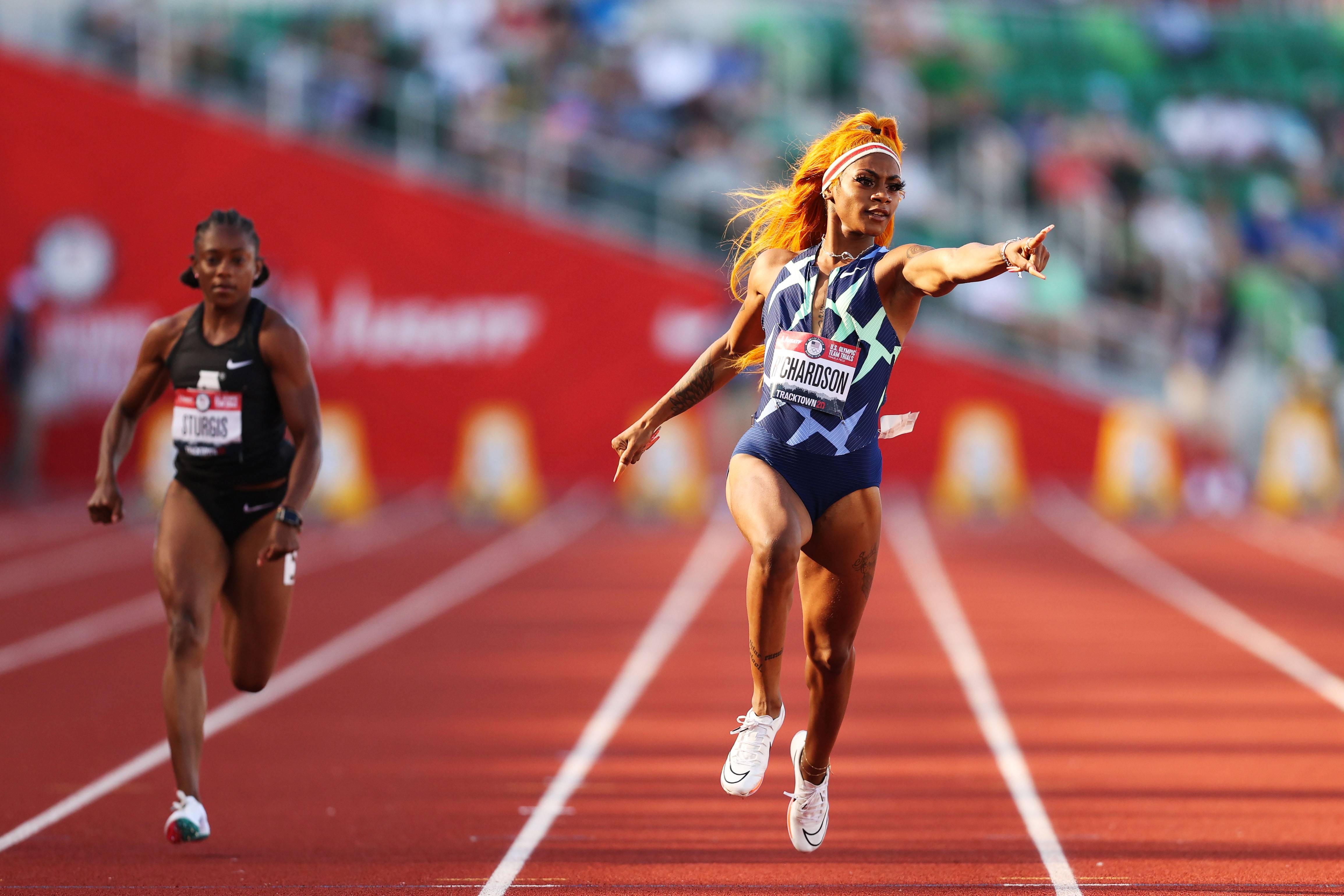 EUGENE, OREGON - JUNE 19: Sha'Carri Richardson competes in the Women's 100 Meter Semi-finals on day 2 of the 2020 U.S. Olympic Track & Field Team Trials at Hayward Field on June 19, 2021 in Eugene, Oregon. (Photo by Patrick Smith/Getty Images)