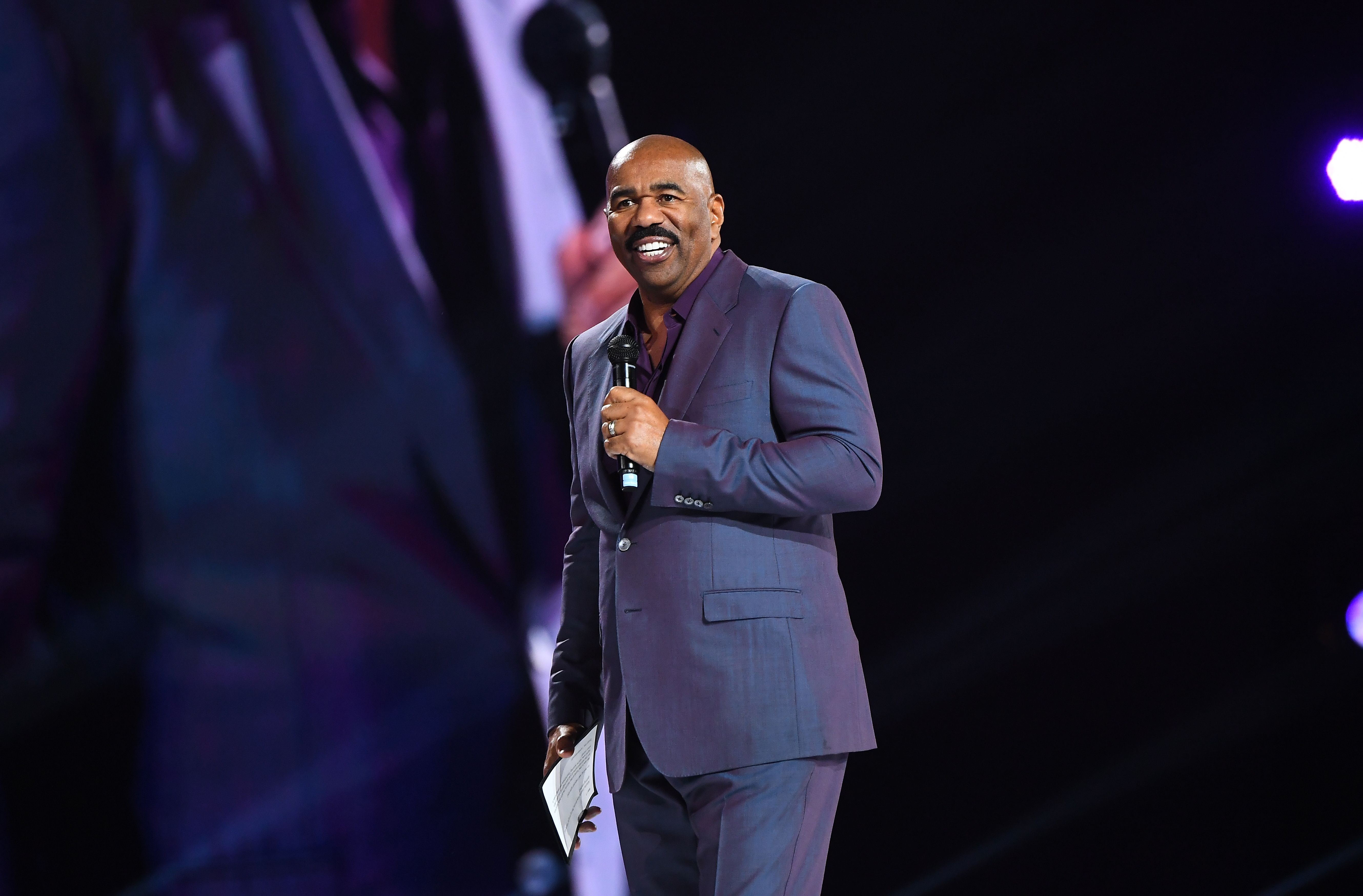 ATLANTA, GEORGIA - MARCH 21:  Steve Harvey speaks onstage during 2019 Beloved Benefit at Mercedes-Benz Stadium on March 21, 2019 in Atlanta, Georgia. (Photo by Paras Griffin/Getty Images)