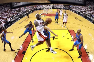 Up and Up - James soars up to sink a basket in the second half. (Photo: Ronald Martinez/Getty Images)